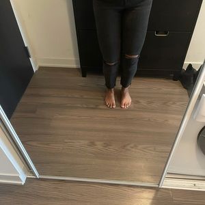 Madewell distressed black jeans.